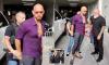 Brazen Andrew Tate appears to try and slip phone to bodyguard as he is arrested over child porn charge