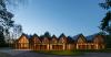 gabled timber volumes weave sanctum cabin retreat into the lithuanian forest