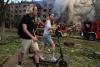 In one of Kyiv’s most frequently bombed neighborhoods, residents choose to stay