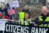 Citizens Bank says it has ended lending to private prison companies used by ICE