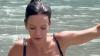 Lily Allen wows in tiny black bikini for dip in the lake on Switzerland holiday