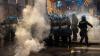 Riots erupt after migrant’s death during arrest in Italy as cars are set alight and protesters chant ‘police murderers’