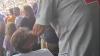 Shocking moment older spectator slaps young sports fan for not standing up during US national anthem in viral video