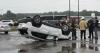 Car ends up on roof in bank parking lot