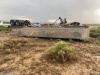 Empty ore haul truck involved in weather-related rollover