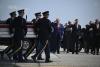 Speaking for fallen soldiers, Trump says they supported the Iran war
