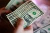 Dollar rides yield surge as Middle East and trade wars raise inflation stakes