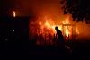 Tens of thousands flee wildfires as heatwave grips southern Europe