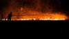 Horror as holiday hotspot ravaged by wildfires with hundreds fleeing on boats