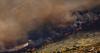 Tens of thousands evacuated as wildfires hit Spain and southern France