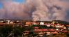 Tens of thousands flee raging wildfires in France and Spain, some escaping by boat