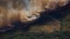 Tens of thousands of people evacuated as wildfires rage in tourist hotspots