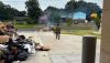 Oklahoma City firefighters extinguish trash fire dumped in front of station by garbage truck