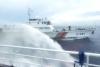 China Coast Guard blasts Philippine vessels with water