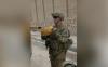 From the archives: A soldier holds a homemade explosive in Afghanistan, 2012