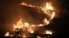 Almost 300,000 forced from their homes across southern Europe as overnight winds accelerate spread of wildfires