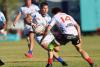 Wanderers go top after bruising battle 