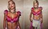 Rita Ora shows off her taut abs in a red and pink lace bra top after wowing the crowds at her show in Vienna