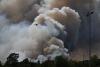 Snow in Athens while France is on fire: The images that lay bare contrast in extreme weather across Europe