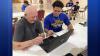 Jersey Proud: Manchester HS football players help seniors build tech skills