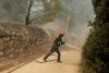 France and Spain race to hold wildfire lines before heat returns