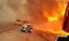Raging French wildfire closes in on missile and rocket factories as 4,000 are evacuated from beach resort