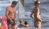 Orlando Bloom, 49, shows off his ripped physique in the beach shower as he puts on a cosy display with bikini-clad model girlfriend Luisa Laemmel, 28, at the beach in Italy
