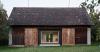 black asphalt and birch plywood shape compact retreat within czech barn