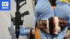 Military-grade assault rifles and live grenades found in alleged safe house