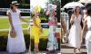 Glorious day for Goodwood! The sun shines on revellers arriving in flamboyant hats and bold prints for day two