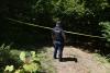 Forensic teams search a suspected mass grave from the Kosovo war