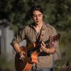 NICK GARRETT-POWELL, THE MUSIC GUY – by Larry Rosen