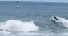 CAUGHT ON CAMERA: Great white shark jumps out of water behind Newport Beach surfer