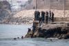 ‘Absolute chaos’ as thousands of people breach Morocco’s border with Spain’s Ceuta