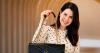 Who is Esmeralda Boss, the Cuban owner of a business in Miami that rewards her clients with luxury handbags?