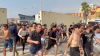 Watch: Hundreds race through Ceuta after swimming into Spain as city calls for national emergency