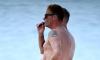 Ant McPartlin, 50, is left in hysterics over shirtless beach picture of himself next to his 'larger' friend that created awkward optical illusion