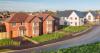 Taylor Wimpey cuts shareholder returns amidst 'housing market...