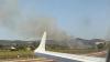 Horrifying moment wildfire ignites next to Ibiza airport runway as panicked Brit tourists fear plane will ‘blow up’
