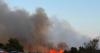 Farmers rally to save houses and caravans from raging wildfire