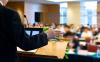 At a Kansas data center meeting, a teacher clapped six times, then officers dragged him out