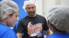 Derek Jeter joins students at IMG to pack food for local families