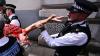 The Week in Pictures: More than 100 arrests outside Westminster Magistrates' Court, and thousands of Kate Bushes dance to Wuthering Heights