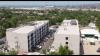 61 young Jamaicans receive keys to Howard Avenue studio apartments