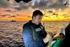 He’s a Northeastern grad commanding a Coast Guard vessel in Guam