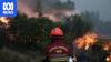 Wildfires force mass evacuations in Europe as Australia sends help
