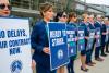 Canadians stand with WestJet flight attendants