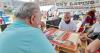 Dominoes bring together family, friends, and strangers at Puerto Rican Festival