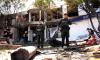Truck explodes outside Colombia police base, injuring 11 officers, killing dog