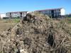 Macassar residents fear health hazards from sludge stockpiles near stormwater canal